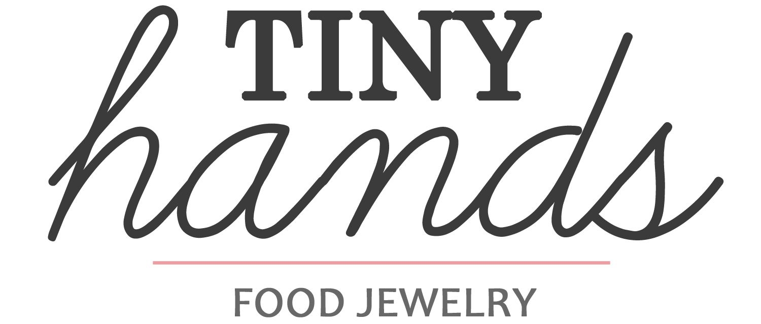 The logo for Tiny Hands.