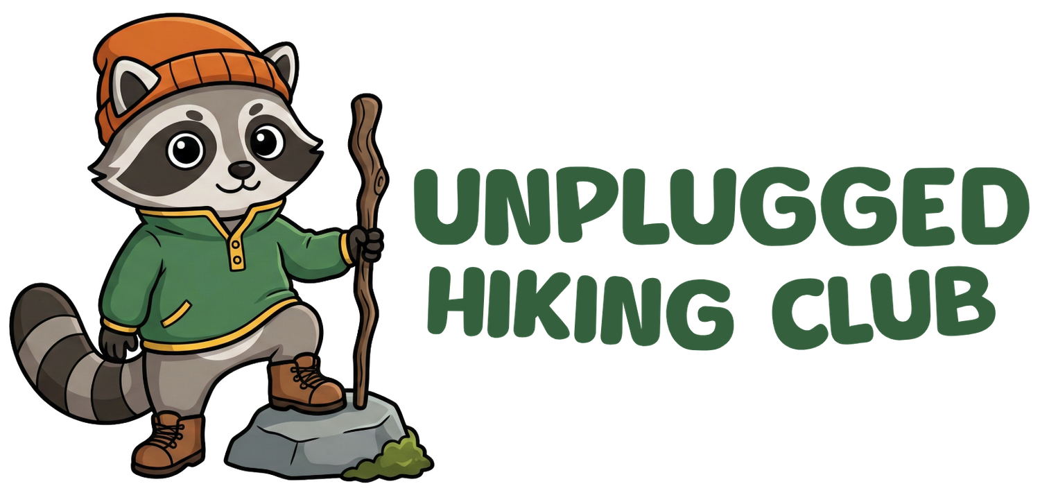 The logo for Unplugged Hiking Club.
