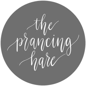 The logo for The Prancing Hare.